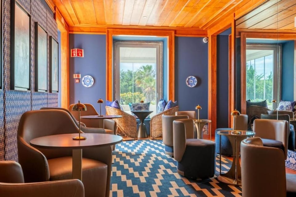 Enjoy garden views while lounging in serene, sunlit seating.