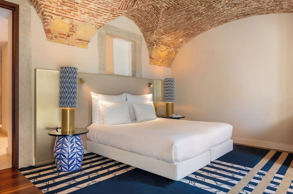 Sink into cloud-soft bedding beneath the stunning brick vaults.