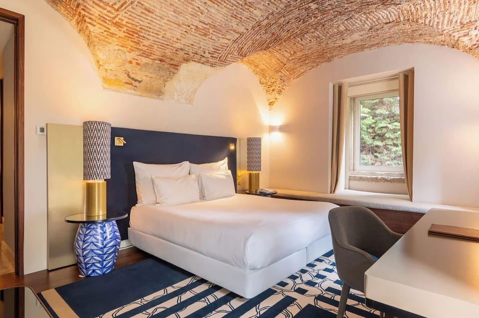 Settle in comfortably with a dedicated desk and restful bed.
