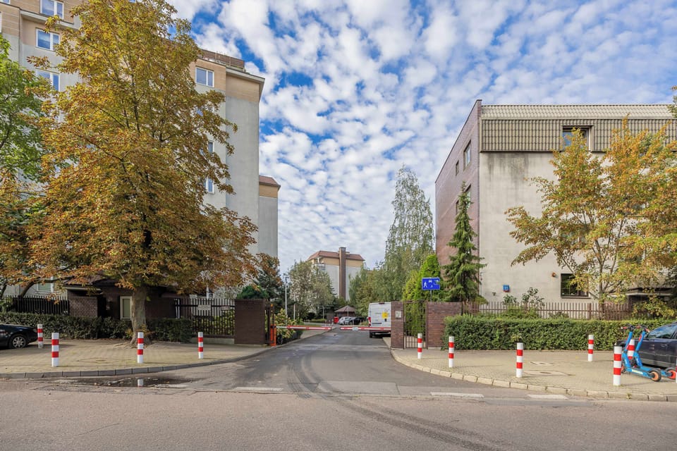 The street with trees and calm traffic creates a friendly environment ideal for daily walks.