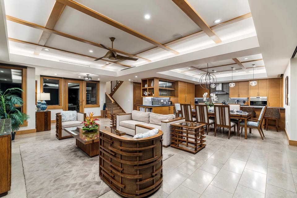 The spacious great room features multiple seating areas and seamless flow.