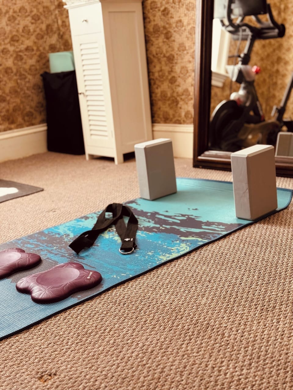 Yoga equipment and Peloton in the Fitness Nook.