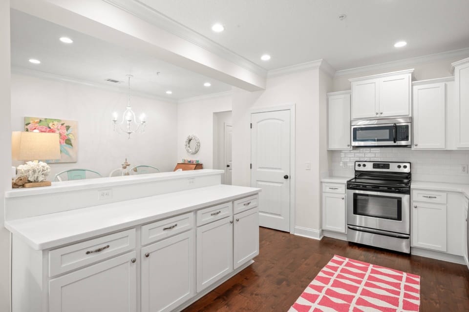 The large, clean kitchen has plenty of counter space and a panty closet to store all your groceries out of sight.