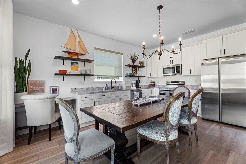 Stylish kitchen with a dining area and white cabinets