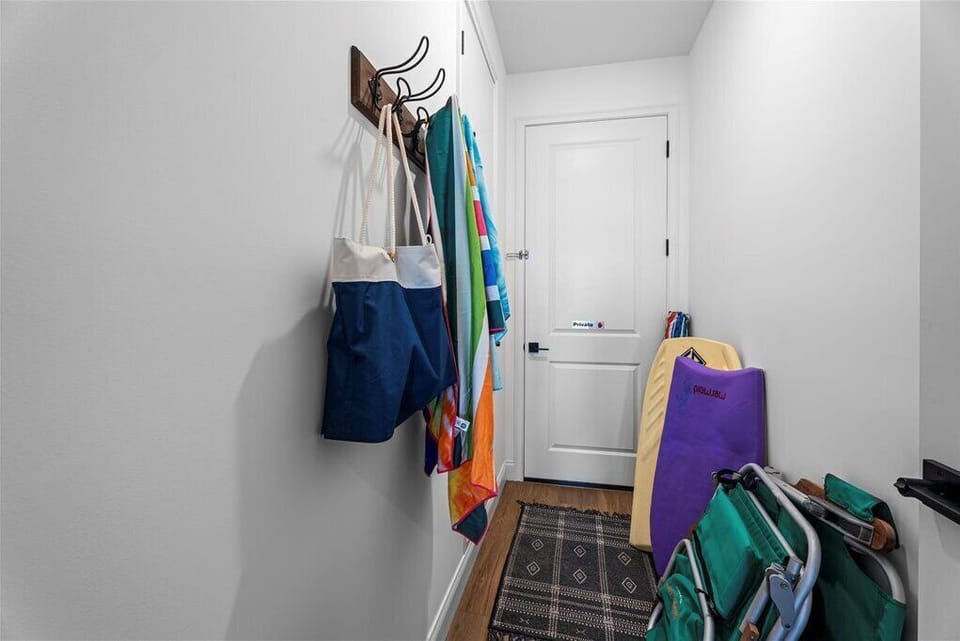 Beach essentials organized in a hallway.