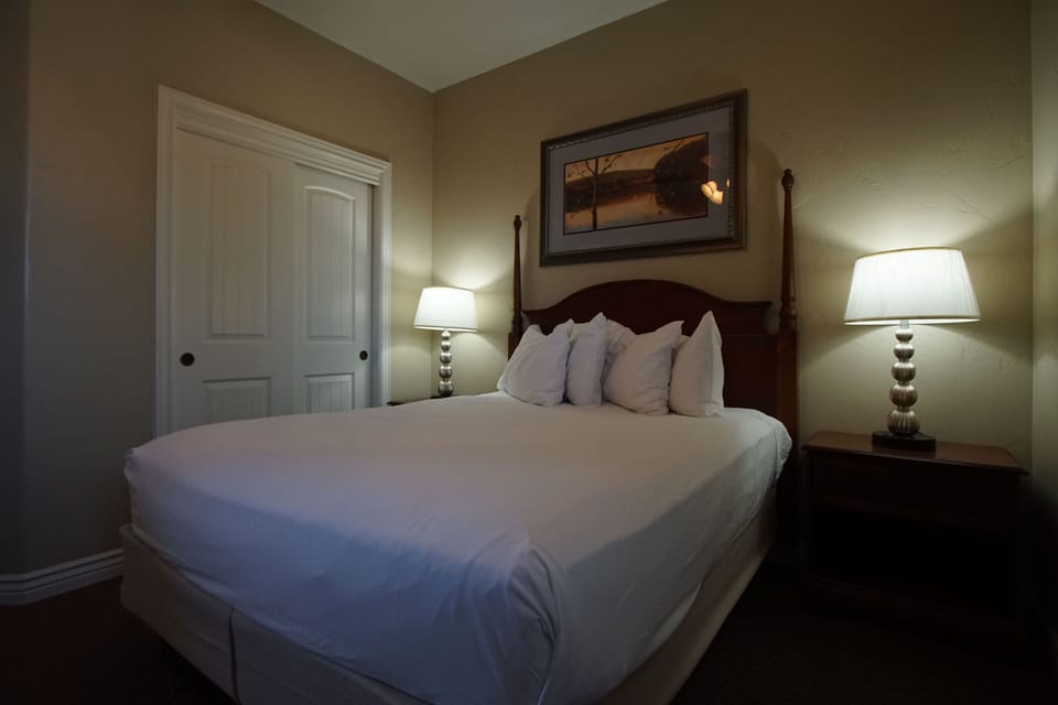 Inviting guest bedroom with queen bed and cozy furnishings.