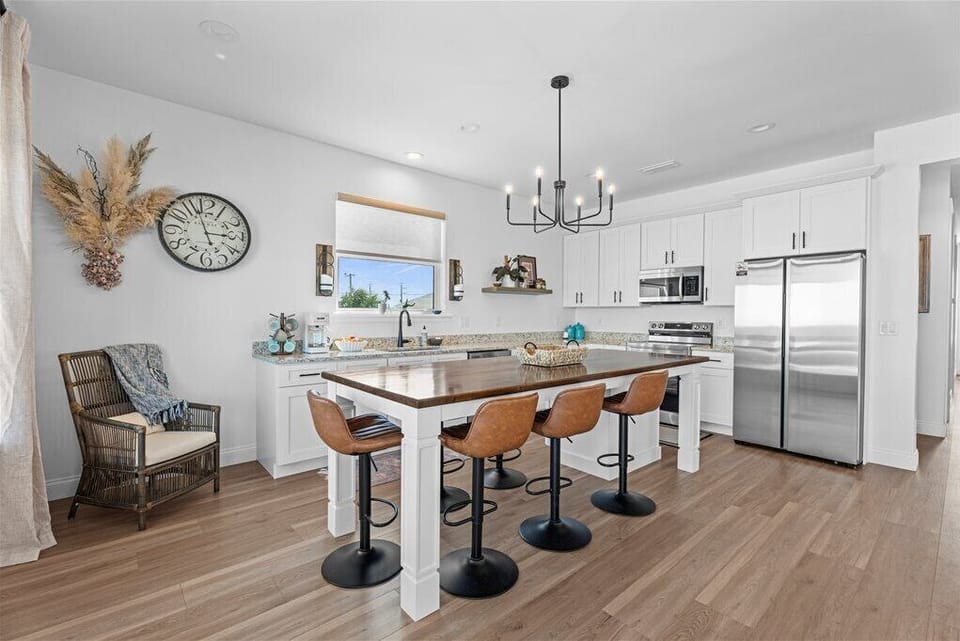 Bright, modern kitchen with a large island and stylish decor.