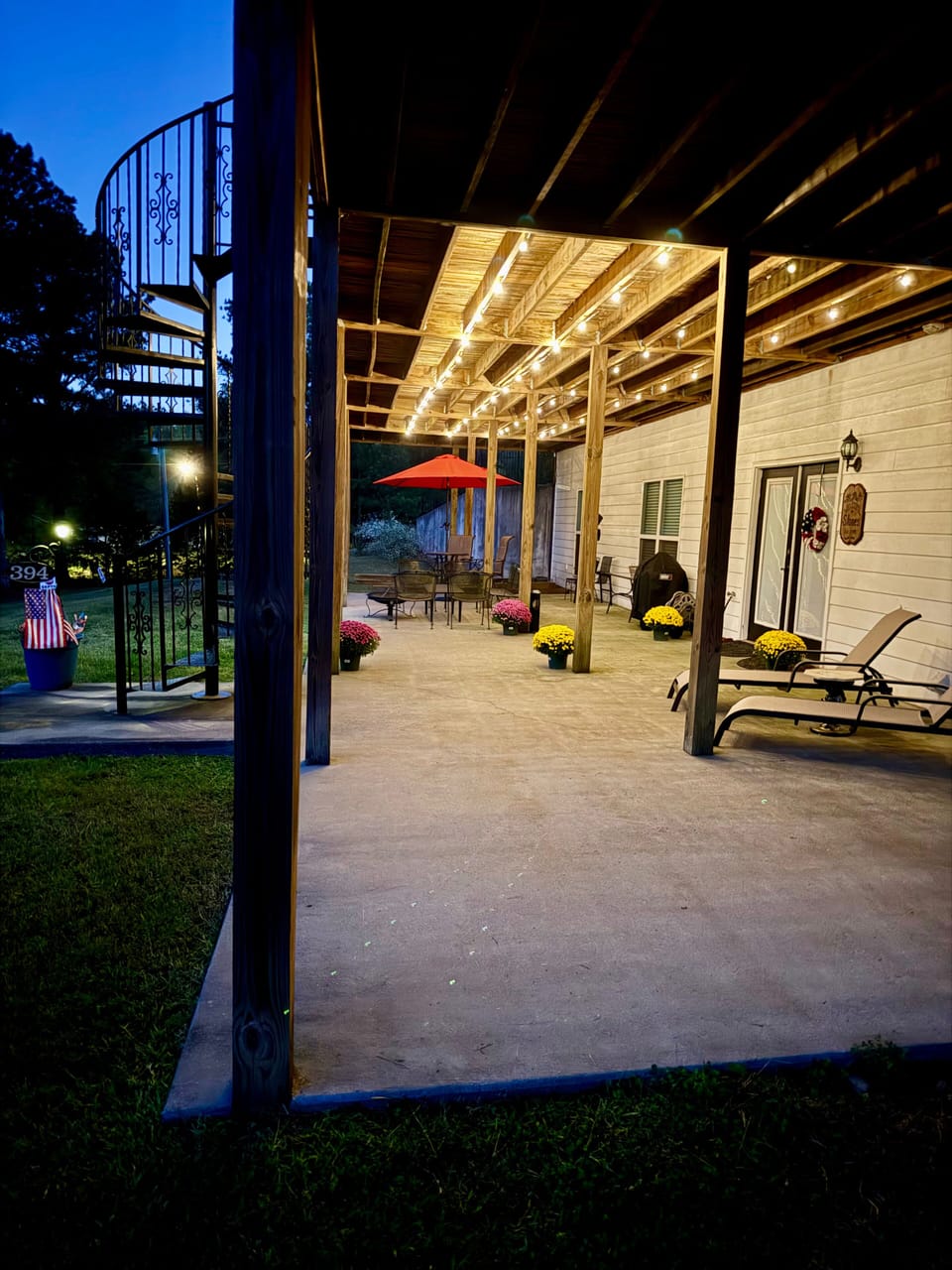 Patio with elegant outdoor lighting and plenty seating