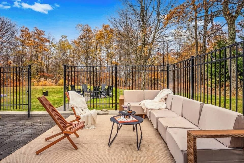 Sunny patio w/ lounge chairs & dining table for relaxing outdoors