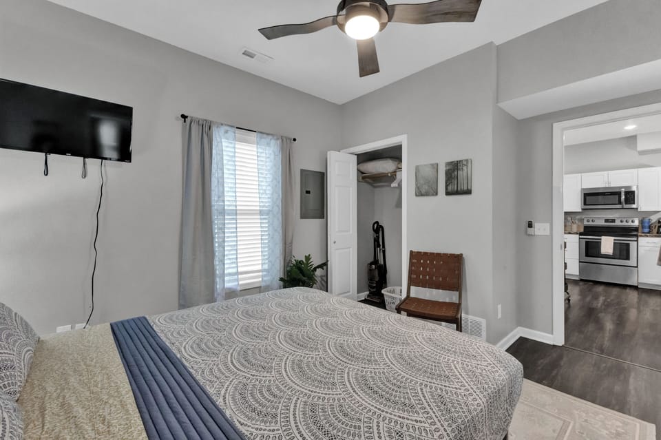Cozy queen bedroom with smart TV