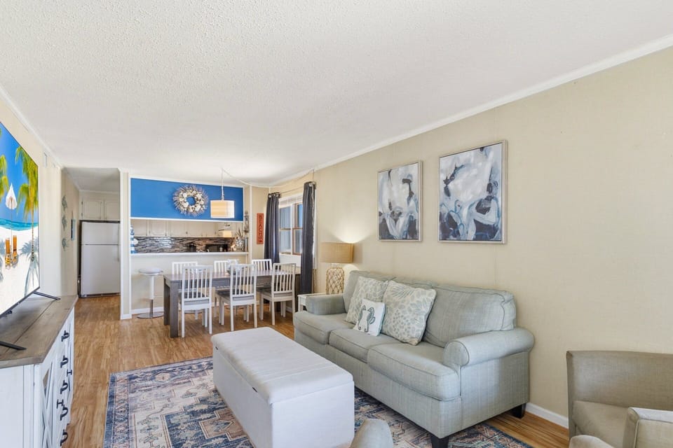 Cozy oceanfront living space with comfortable seating and direct access to the private deck.