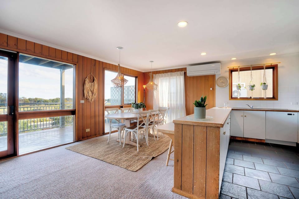 Enjoy stunning scenery through the large windows while dining.