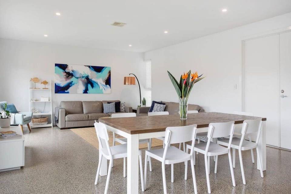 Open plan living seamlessly connects the living, dinning and kitchen areas.