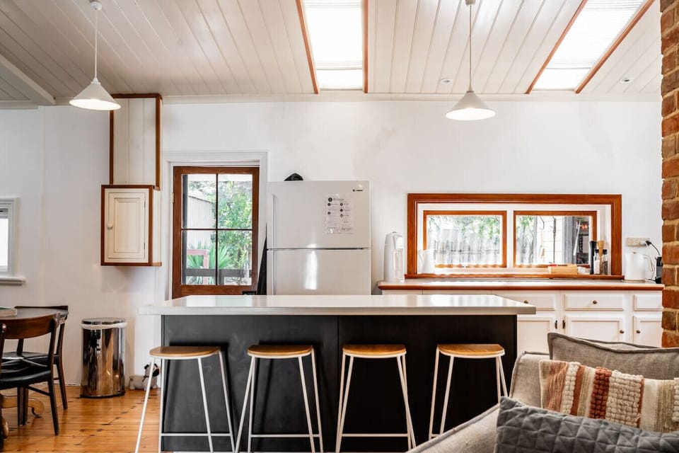 Pull up a stool at the kitchen island and linger over breakfast, coffee, or shared conversation as the day unfolds.