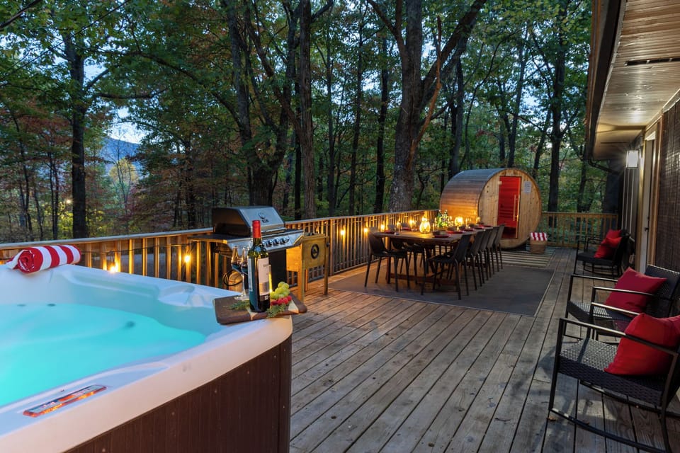 Escape to serenity with our dining space, sauna, and hot tub nestled among the trees.