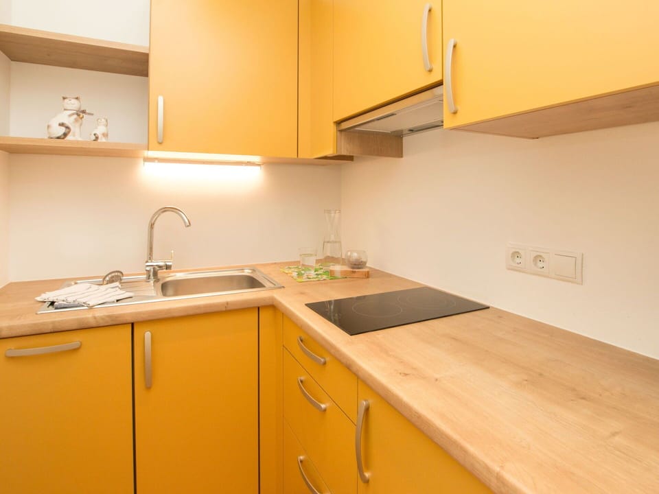 Kitchen, Countertop, Wood, Flooring, Interior Design, Yellow, Kitchen Sink, Cabinetry, Floor, Kitchen Appliance