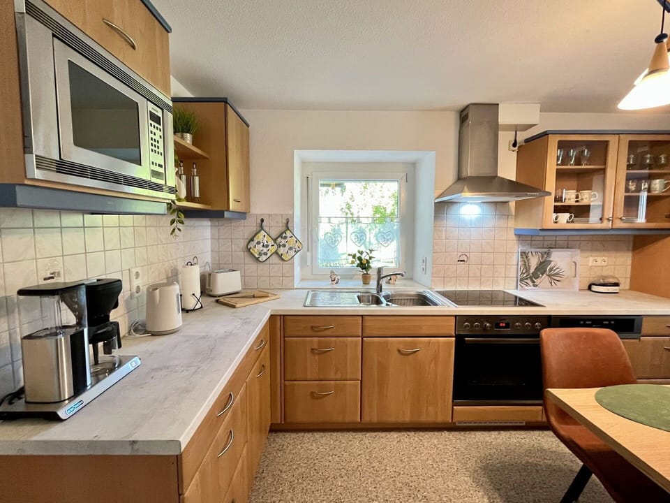Countertop, Kitchen, Kitchen Appliance, Cabinetry, Furniture, Interior Design, Major Appliance, Flooring, Wood, Sink