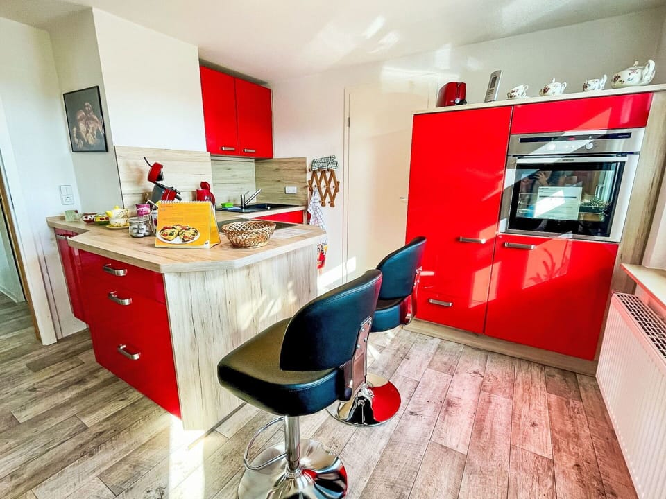 Flooring, Furniture, Interior Design, Floor, Cabinetry, Kitchen, Countertop, Room, Cupboard, Apartment