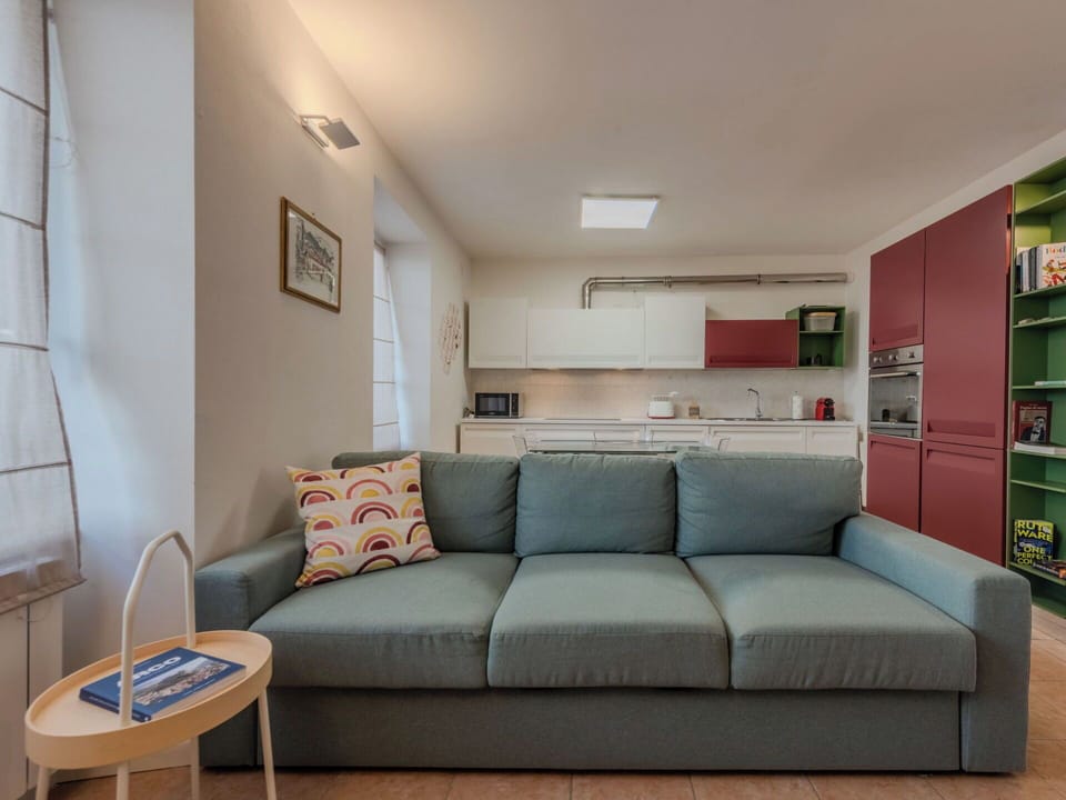 Furniture, Interior Design, Couch, Flooring, Floor, Wall, Room, Wood, Ceiling, Table