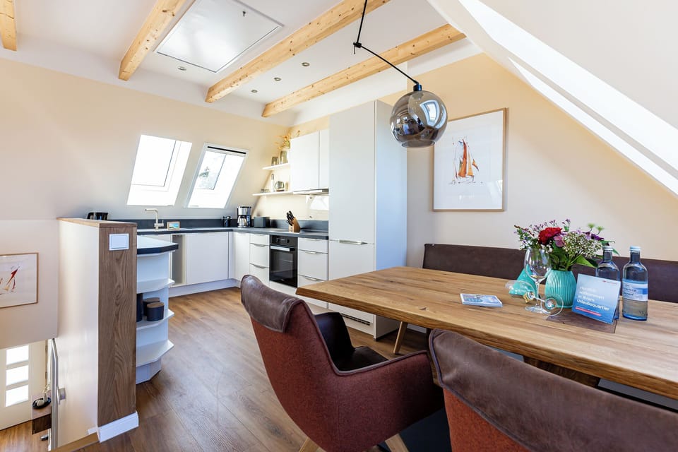 Modern Kitchen with Dining Table and Wooden Shelves