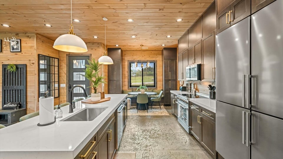 Large kitchen island and sink in the fully equipped kitchen