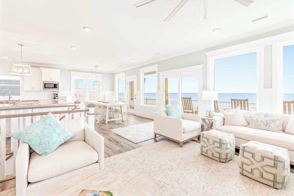 Living Room w/ Comfortable Seating, Flat Screen TV, Large Windows, and Beautiful Ocean Views
