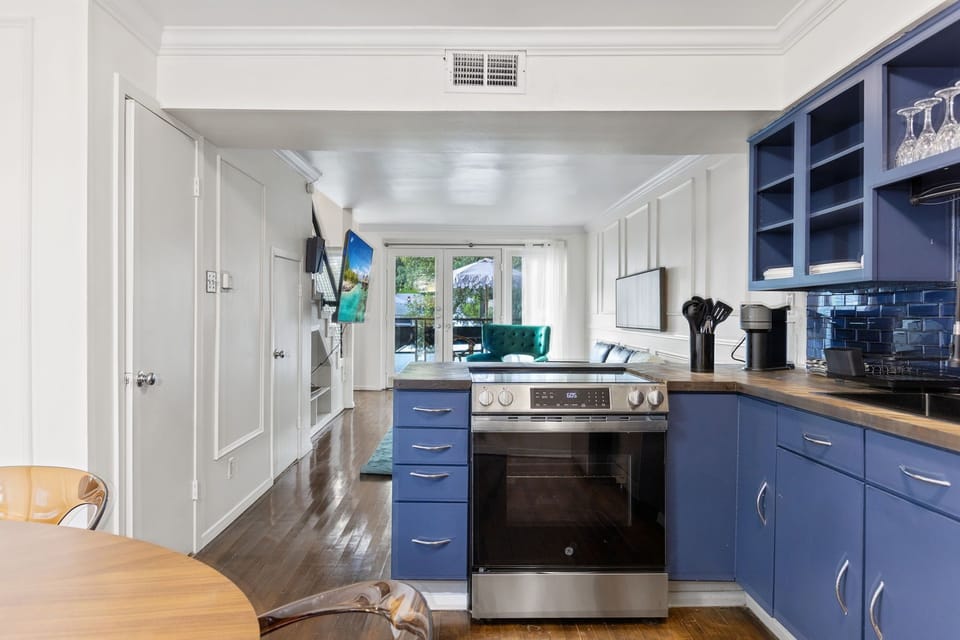 Spacious kitchen with sleek, modern appliances, fully equipped for all your cooking and dining needs