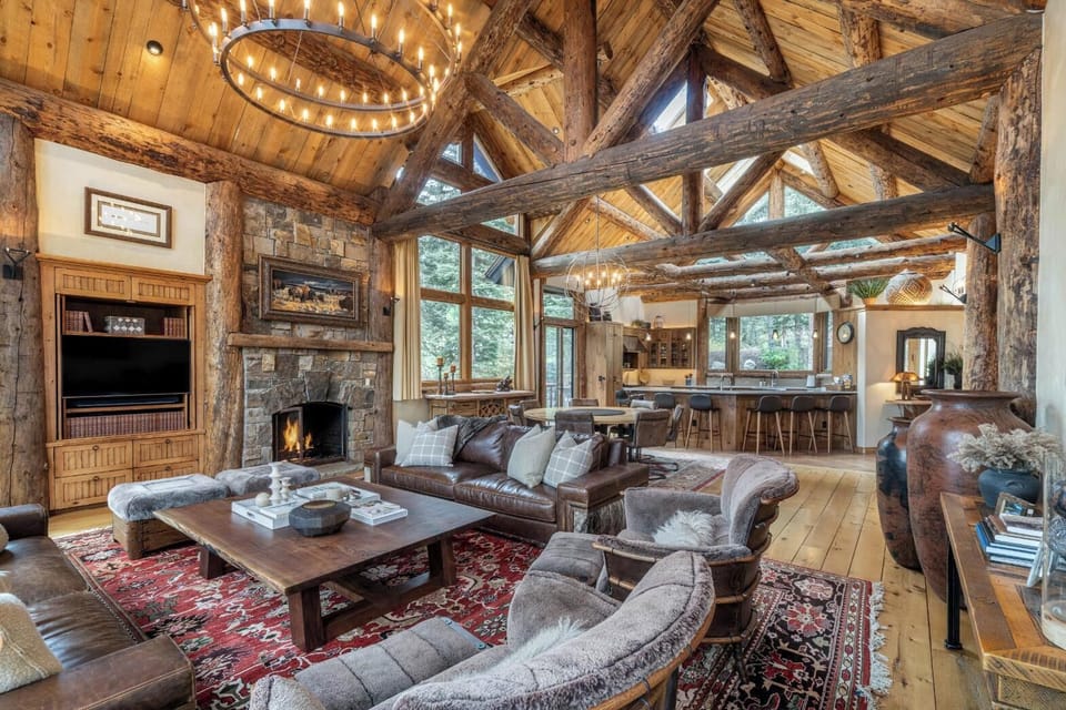 Living Room - Soaring vaulted ceilings and exposed wood beams with plush furnishings