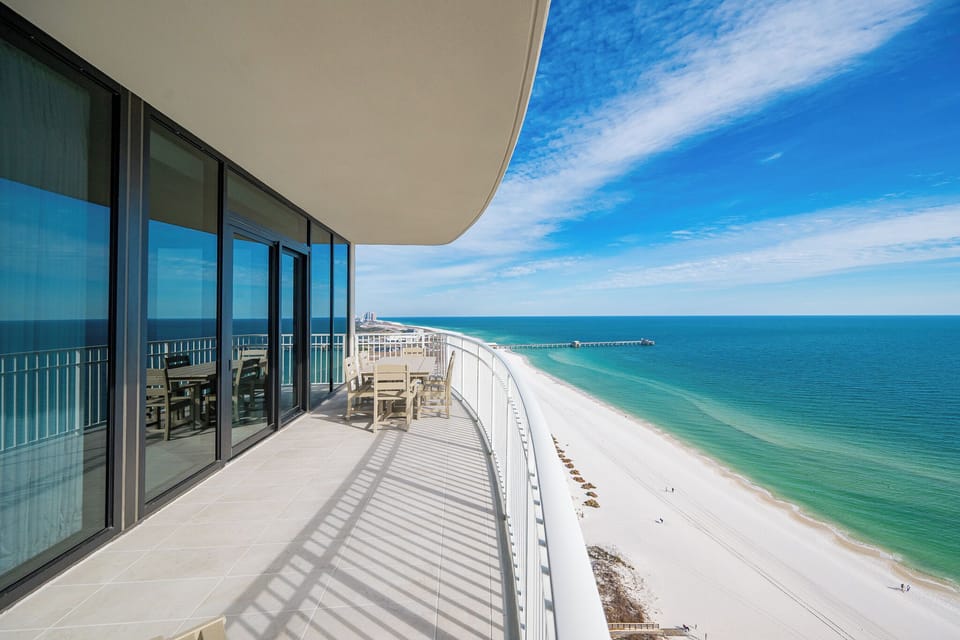 Experience the seemingly endless horizon and coastline views from your beachfront balcony