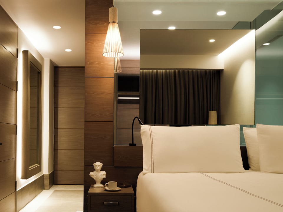 Drift off comfortably with sleek bedside lighting and quiet design.