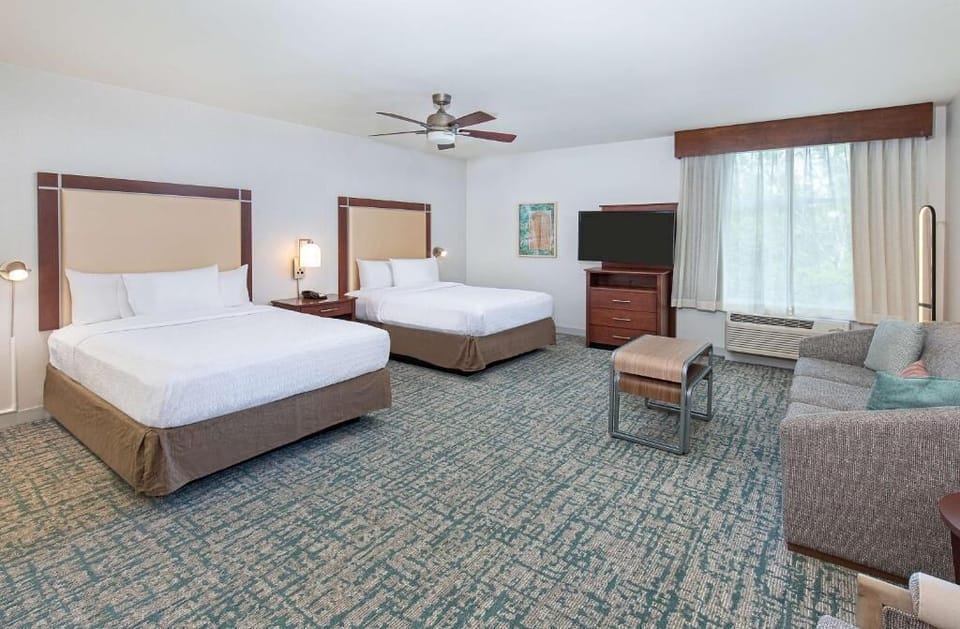 Unwind in a spacious suite with two plush beds.