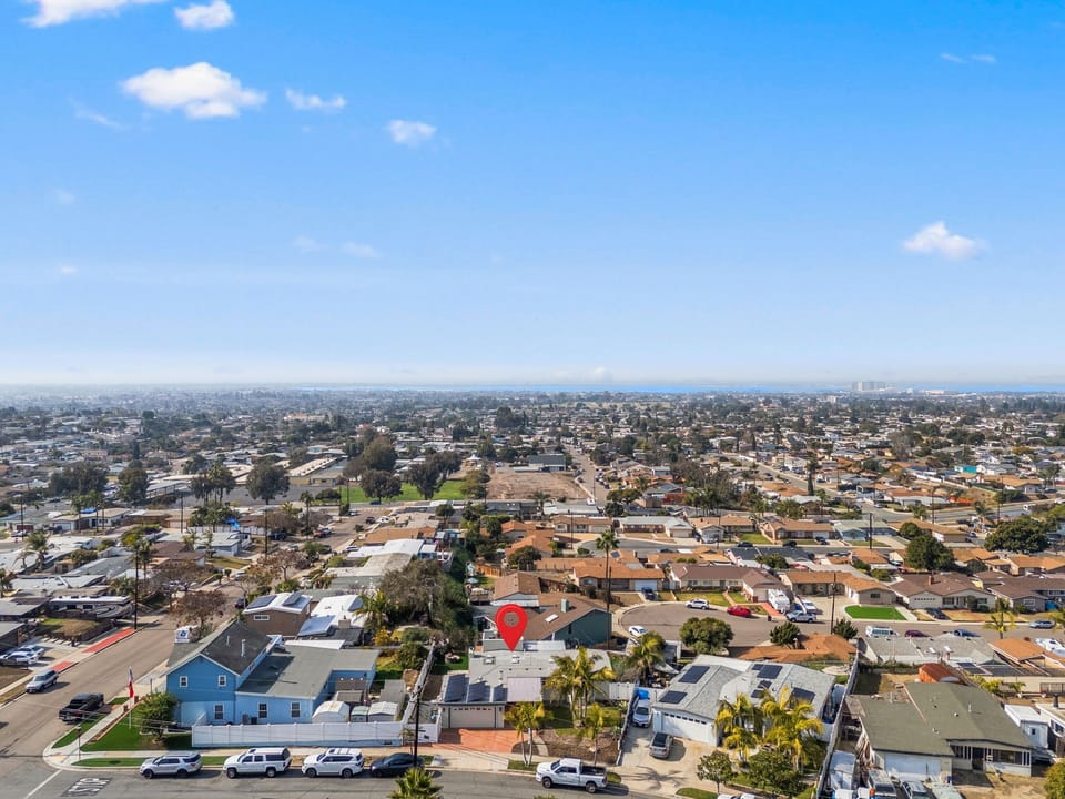 Expansive aerial shot with your home close to parks and open spaces.