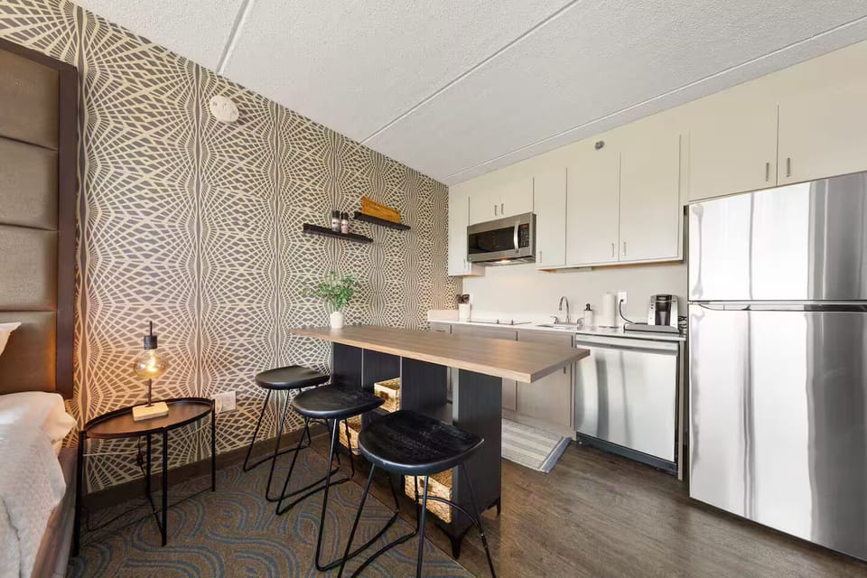 Contemporary kitchen with stainless appliances & stylish breakfast bar