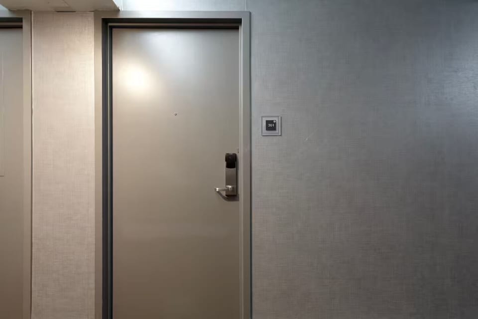 Modern entry door to Room 301 with keycard access for convenience & security