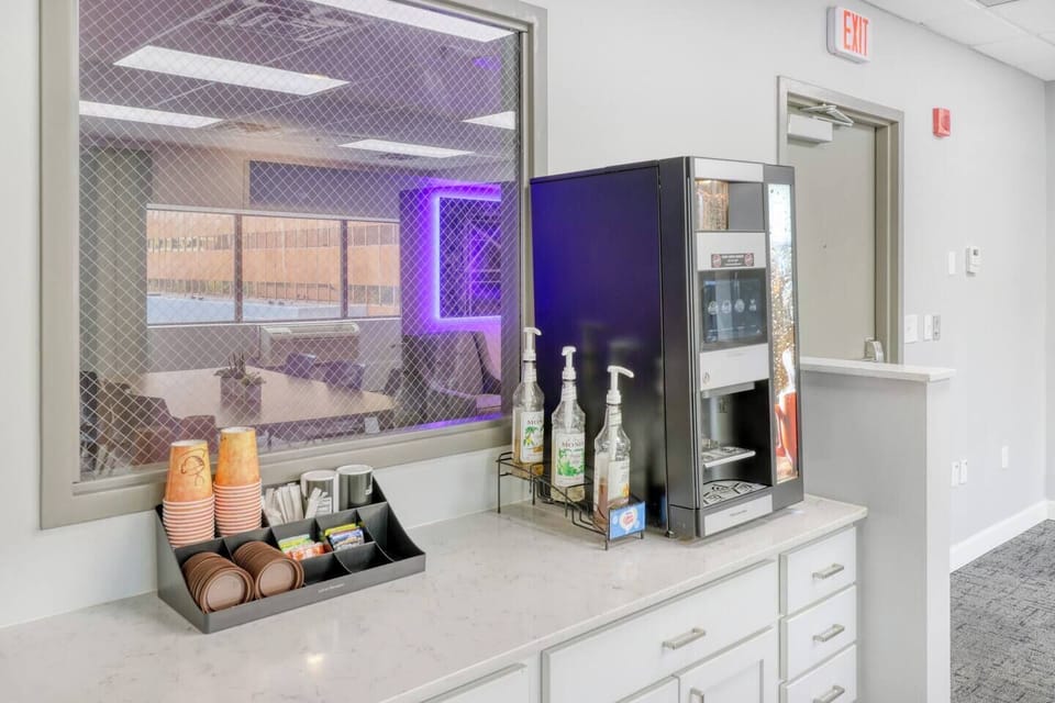 Self-serve coffee bar with flavor syrups & modern machine for your morning brew