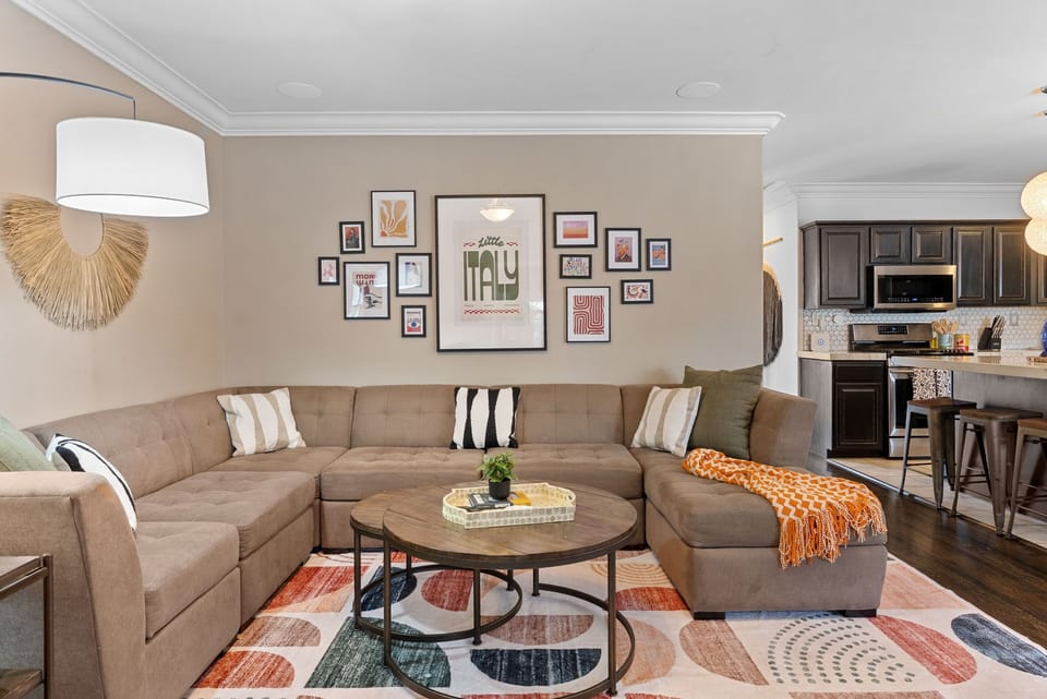 Living room with plush sectional and modern Italian decor