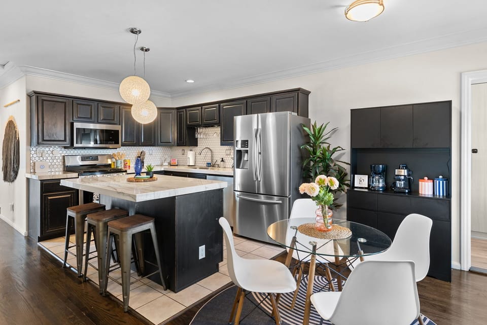 Dining area and kitchen designed for gathering and entertaining