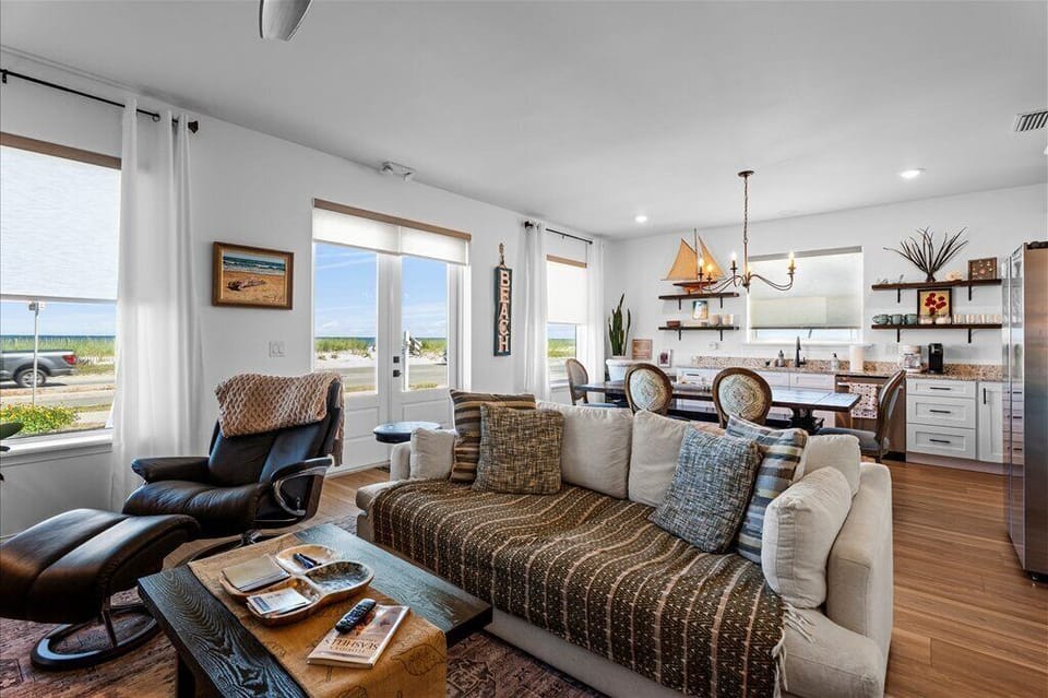 Stylish living room and dining area with a comfortable sofa.