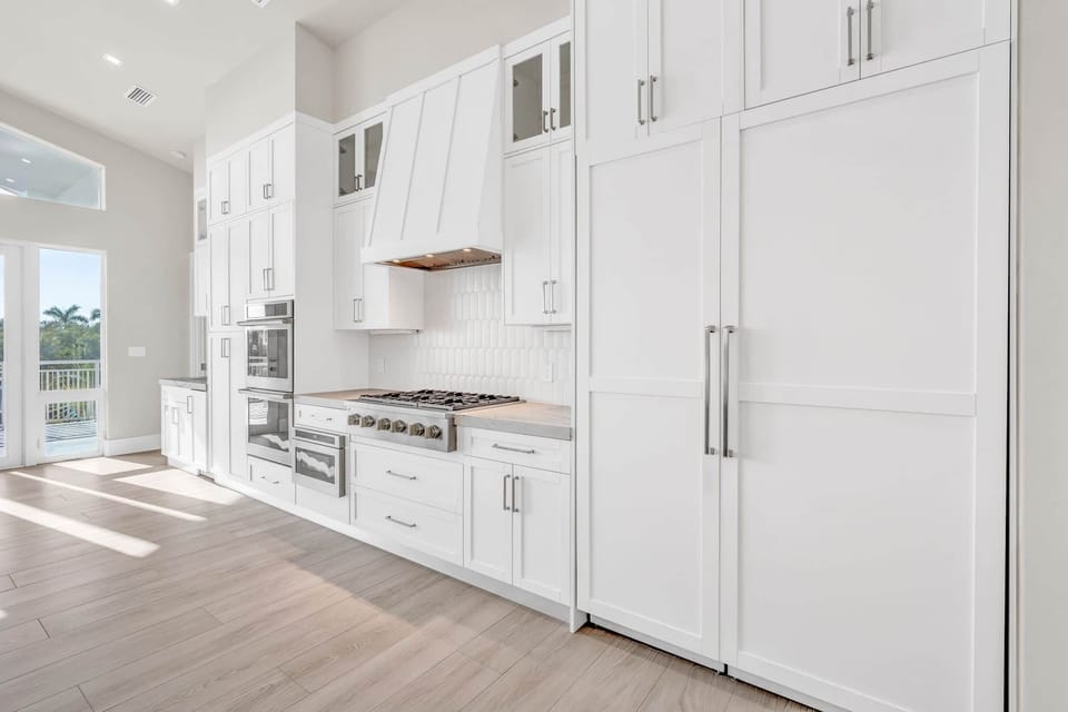 Kitchen area with custom cabinet for the fridge