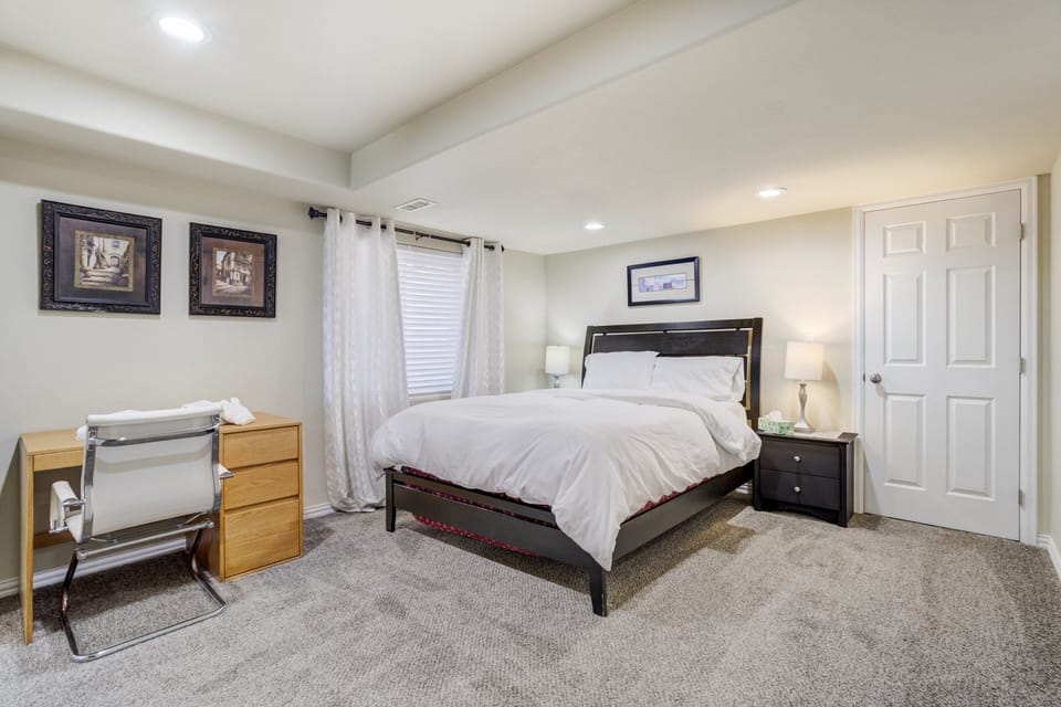 The queen bedroom includes a Roku TV, a work desk