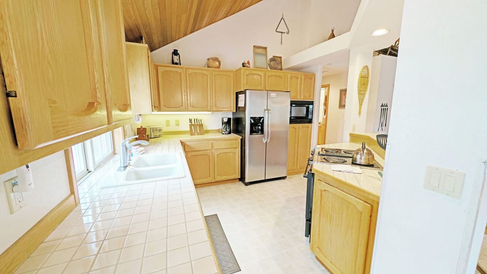 Tiled Counters and a split sink in the Kitchen