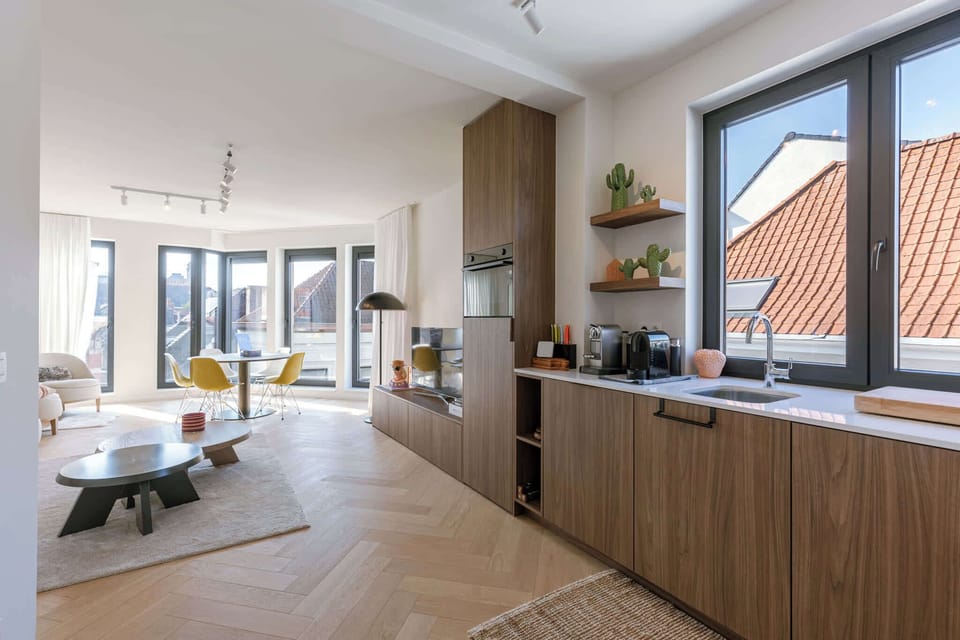 Bright living room with wide windows, perfect for relaxed mornings
