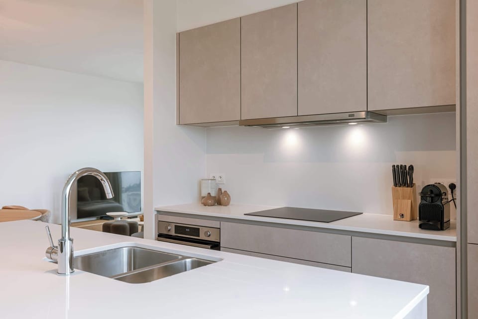 Functional kitchen corner with sink, ready for effortless cooking.