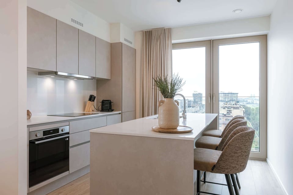 Open kitchen with bar seating, enjoy casual breakfasts together.