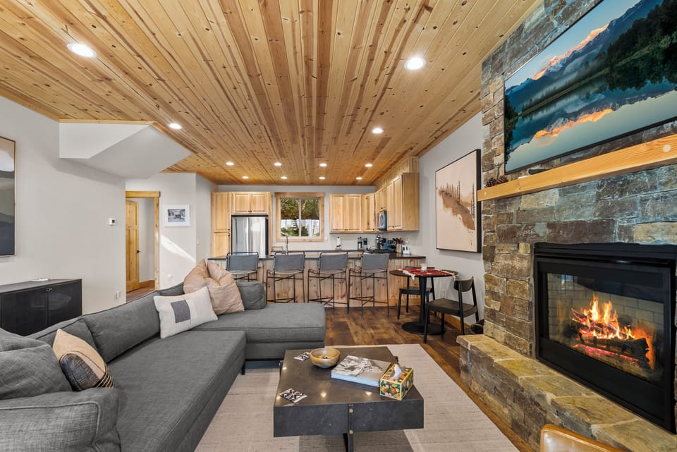 Living Rm w Cozy Fireplace, sectional, smart TV, fully equipped kitchen