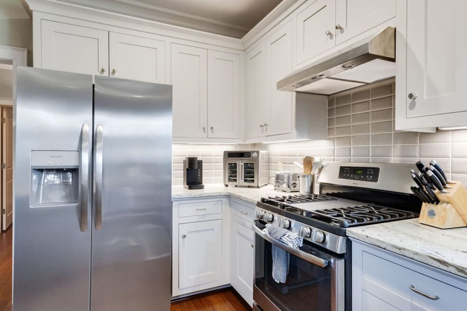 Coffee maker, fridge and stove area