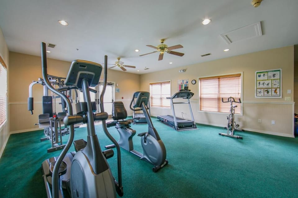 Jump into your routine with a bright, well-equipped fitness room.