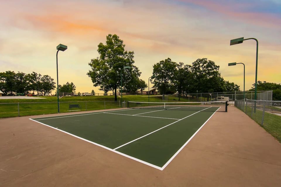 Play a sunset match on the beautifully lit tennis courts.