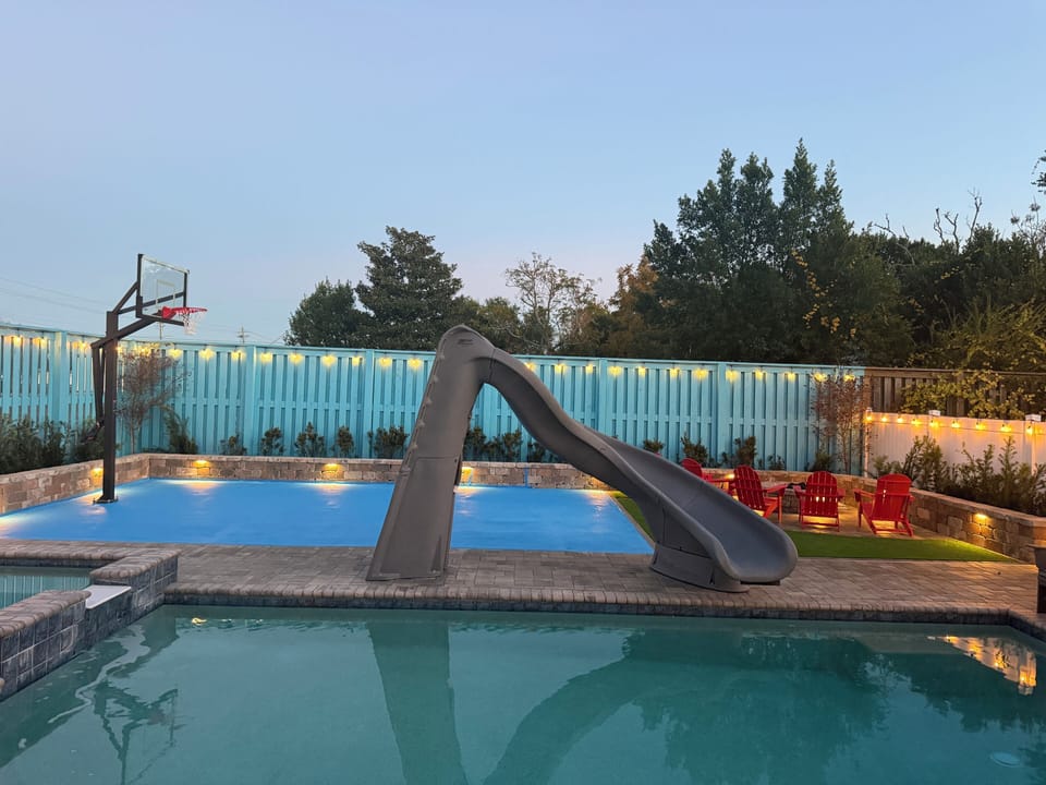 Your private oasis features pool with turbo slide/spa, firepit, sport court
