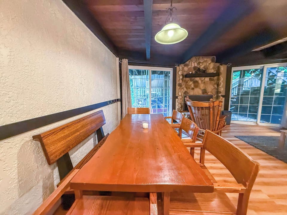 The dining table has a bench seat and five chairs for up to eight people. 